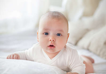 Light close up portrait of adorable baby boy