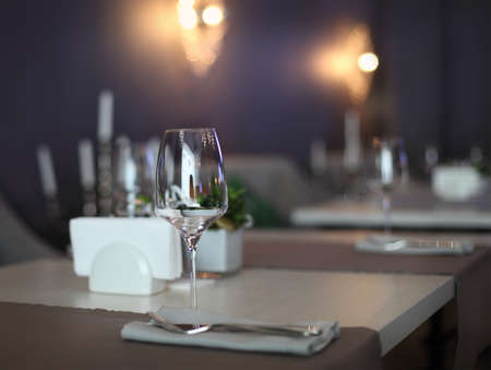 Empty glasses set in restaurant with copy spaceの写真素材