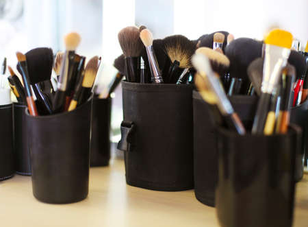 Set of professional cosmetic brushes. Make up brushes near the mirrorの写真素材