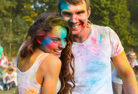 Portrait of happy couple in love on holi color festivalの写真素材