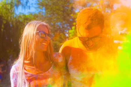 Portrait of happy couple in love on holi color festivalの写真素材