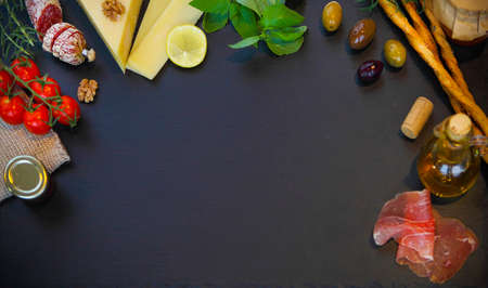 Raw organic vegetables with fresh ingredients for healthily cooking on vintage background, top view, banner. Background layout with free text space.の写真素材