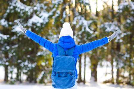 Young woman hiking in white winter forest. Lifestyle conceptの写真素材