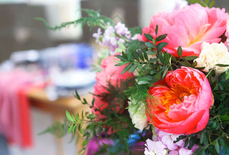 Table setting in vintage style is decorated with flowers in pink and blue colors. Close upの写真素材