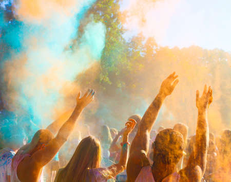 Holi hindu color festival. People holding hands up togetherの写真素材