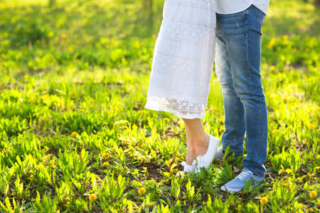 Young couple in love kissing and hugging in nature. Close upの写真素材