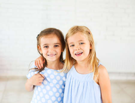 Portrait of two happy smiling young girls. Friendship conceptの写真素材