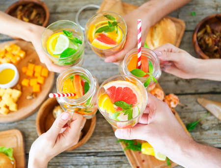 Family dinner with lemonade. Toast. Close upの写真素材