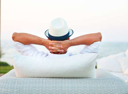 Young man relaxing outdoor on the chair. Lifestyle conceptの写真素材