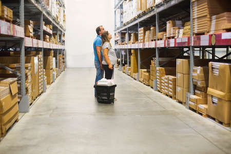 Young pregnant couple in diy store. Repair, building, renovation and home conceptの写真素材