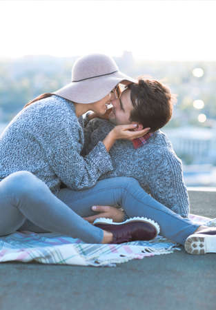 Young man and woman kissing and having fun outdoors Love and relations conceptの写真素材