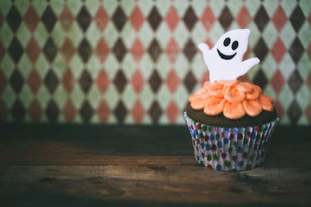 Halloween design homemade cupcake on dark backgroundの写真素材