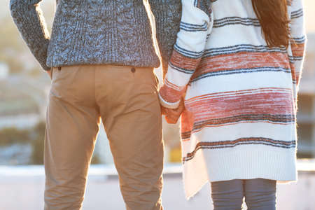 Young man and woman embrace and having fun outdoors  Love and relations conceptの写真素材