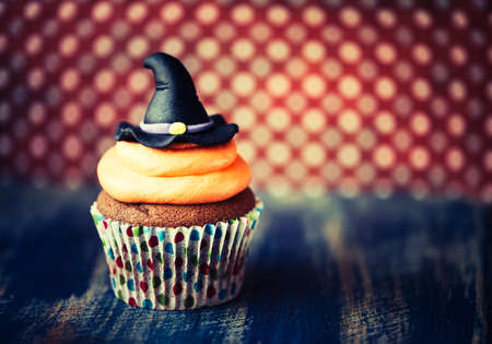Halloween design homemade cupcake on dark backgroundの写真素材