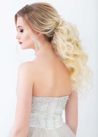 Young pretty bride wearing wedding dress indoorsの写真素材