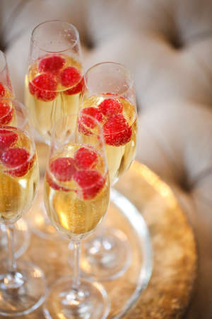Champagne glasses on silver tray. Party and holiday celebration concept