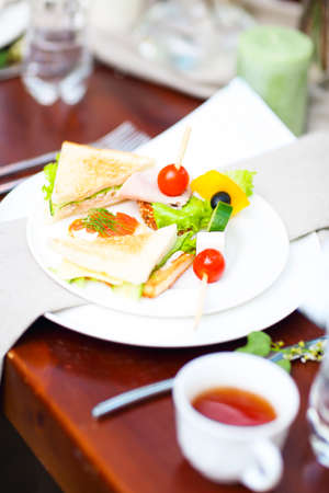 Assorted snacks on the plate. Outdoor catering table の写真素材