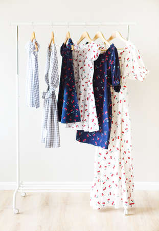 Cloth Hangers with dresses. Women's clothes. Dresses for mother and daughterの写真素材