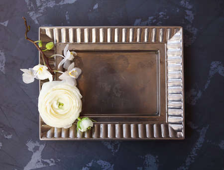 Festive invitation card with beautiful flowers and tray on the dark backgroundの写真素材