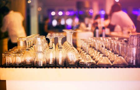 Empty glasses on bar counter. Close upの写真素材