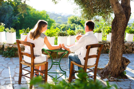 Young family with baby sit outdoorsの写真素材