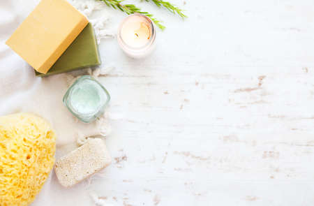 Sea sponge, organic olive soap and bath accessories on stone backgroundの写真素材