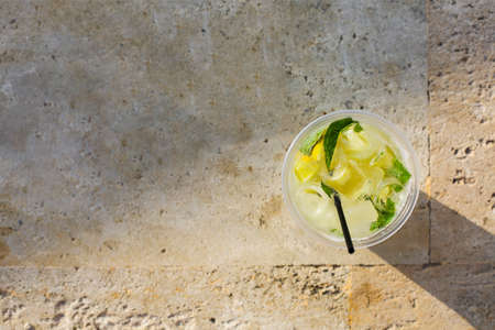 Lemonade glass on stone backgroundの写真素材