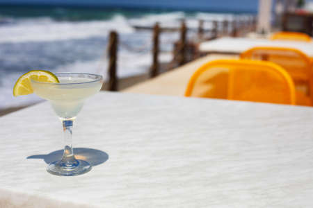 Cocktail glasses on sea background. Margarita