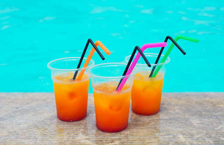Glasses of tropical cocktail on poolside. Close upの写真素材