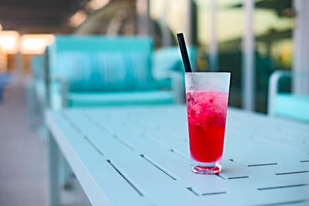 Cocktail glass on table outdoors