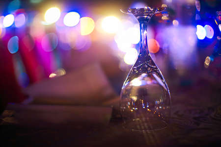 Wineglass outdoors on table by nightの写真素材