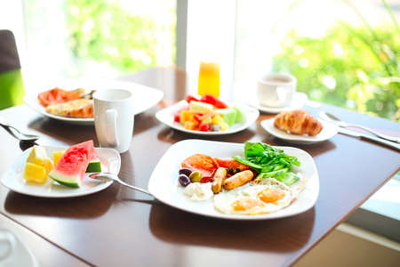 Morning family breakfast with eggs, coffee and fruits. Close upの写真素材