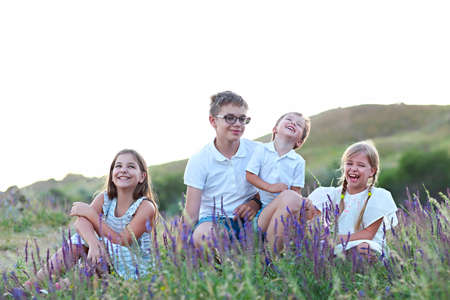 Portrait of the kids playing on the summer medowの写真素材