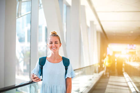 Beautiful happy young woman traveling in metro