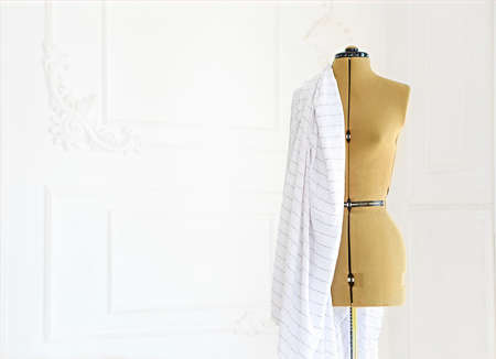 Mannequin with white cloth in the white room