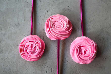 Cool sweet meringues in the roses form. Birthday sweets