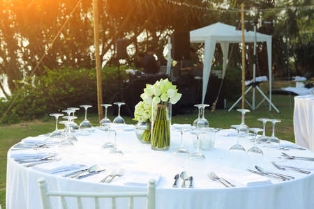Dinning wedding table set with white lotus outdoorsの写真素材
