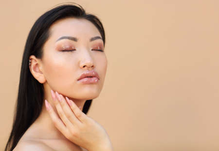Portrait of the beautiful asian model with long dark hair. Beauty conceptの写真素材