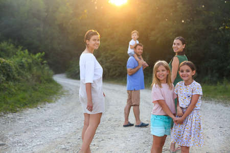 Portrait of the big happy family. Parents with children in countryside outdoorsの写真素材