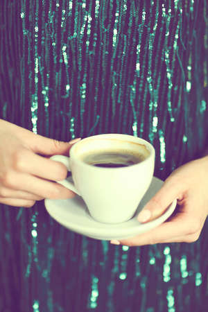 Crop stylish lady with aromatic hot drink の写真素材