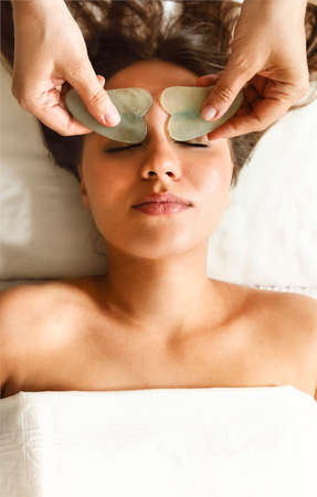 Face gua sha massage or beauty treatment in spa salonの写真素材