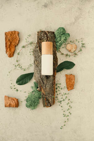 Top view of bottles with cosmetic products placed on various organic ingredients for spa procedureの写真素材