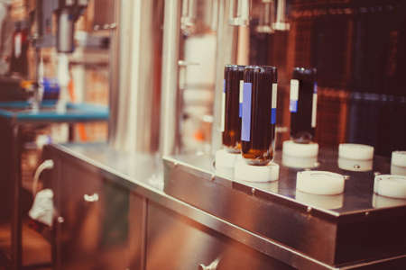 Wine bottles ready to be washed and filled with wine by an industrial machine in a winery