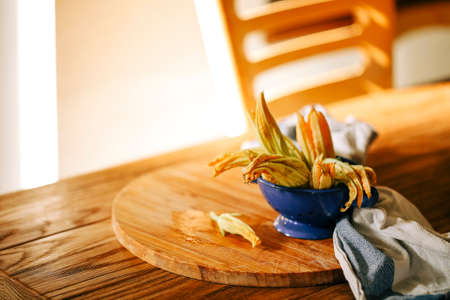 Fresh close up zucchini flowers at the kitchen, deliciousの写真素材