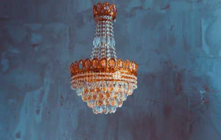 Chrystal chandelier close up. Glamor toed background with copy space