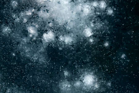 Texture of beautiful blue ice with cracks and air bubbles in the frozen lake. Winter nature abstract background. Lake Baikal, Siberia, Russia.の写真素材
