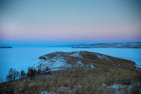 Ogoi island, Lake Baikal, winter landscape. Evening view from Ogoy island to the Small sea of Baikal...