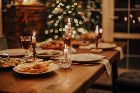 Christmas dinner. The Christmas table is served with a duck, decorated with bright tinsel and...