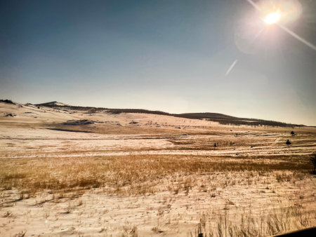Beautiful empty paved road to Lake Baikal. Winter landscape. Travel and holiday concept