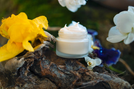 Cosmetics, skin care, beauty, body treatment concept. White cosmetic jar, tube, bottle on green moss...